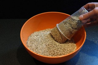 Wet vermiculite is added to the bowl.